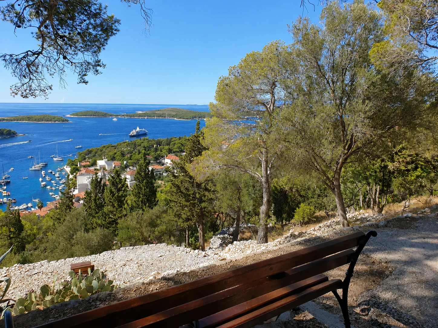 A bench at a viewpoint on the fortress path, looking out over the Pakleni islands